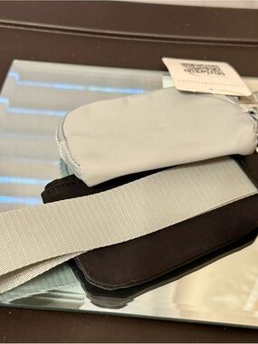 New Gold Blush gray & black pouches on a thick wristlet strap